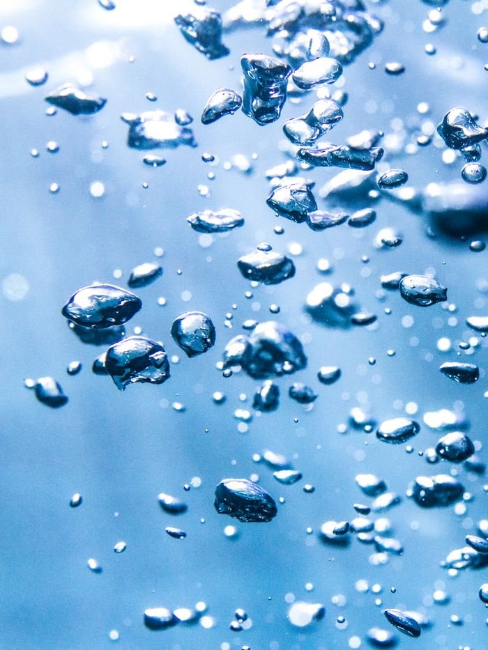 Detailed shot of air bubbles underwater captured in the Windward Islands, French Polynesia.